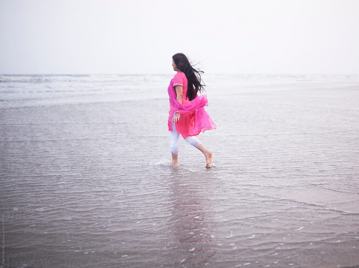Indian Woman Walking Alone In Sea Beach By Dream Lover