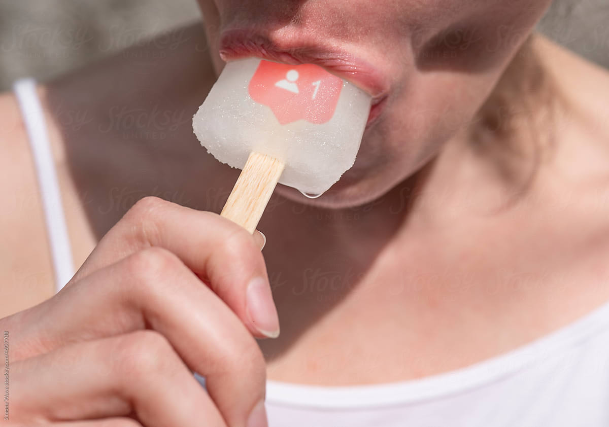 Woman licks ice lolly with followers icon