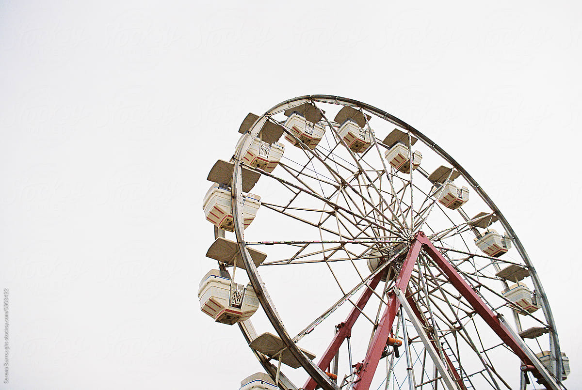 ferris wheel against overcast plain sky