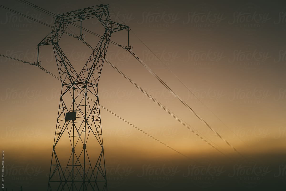 Electric tower surrounded by fog.
