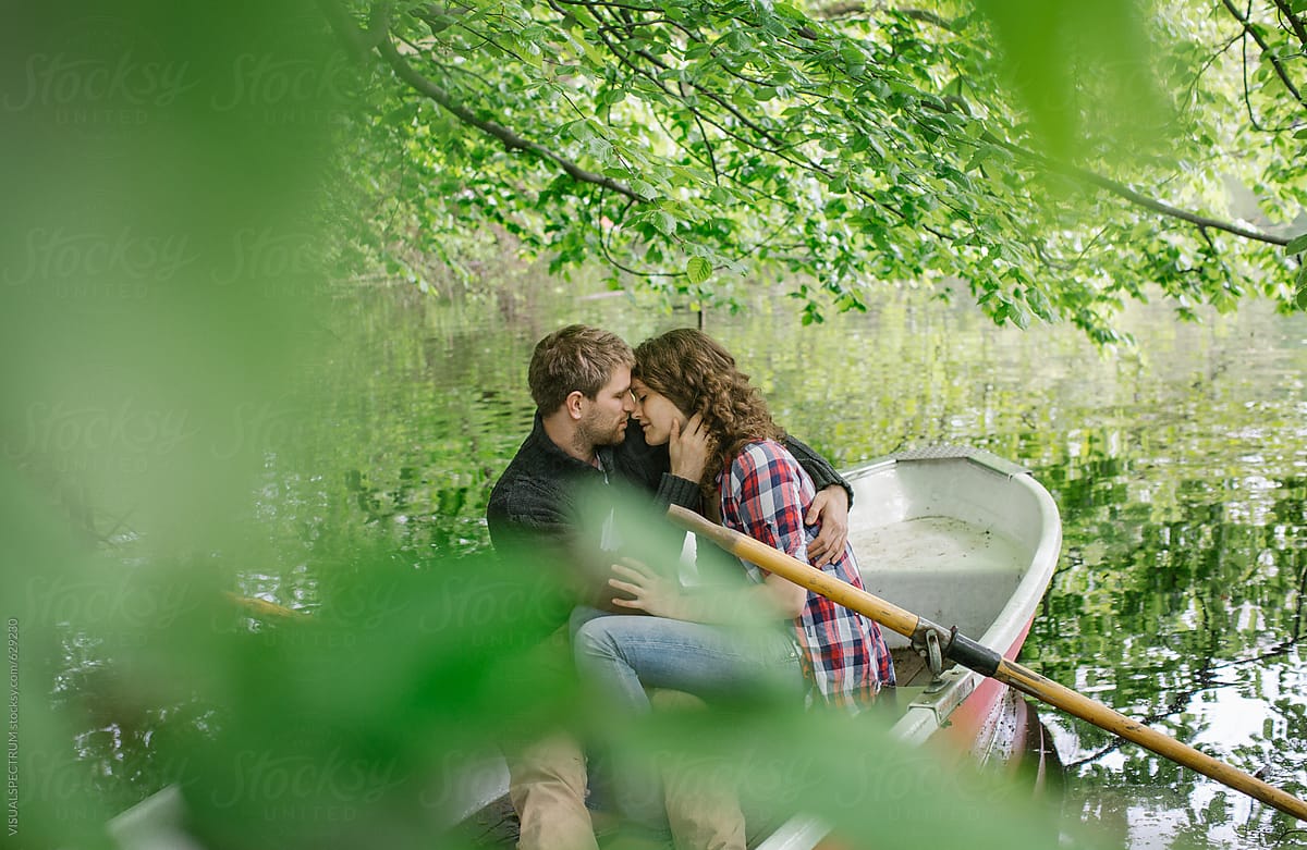 Young Heterosexual Couple Making Out on Rowboat