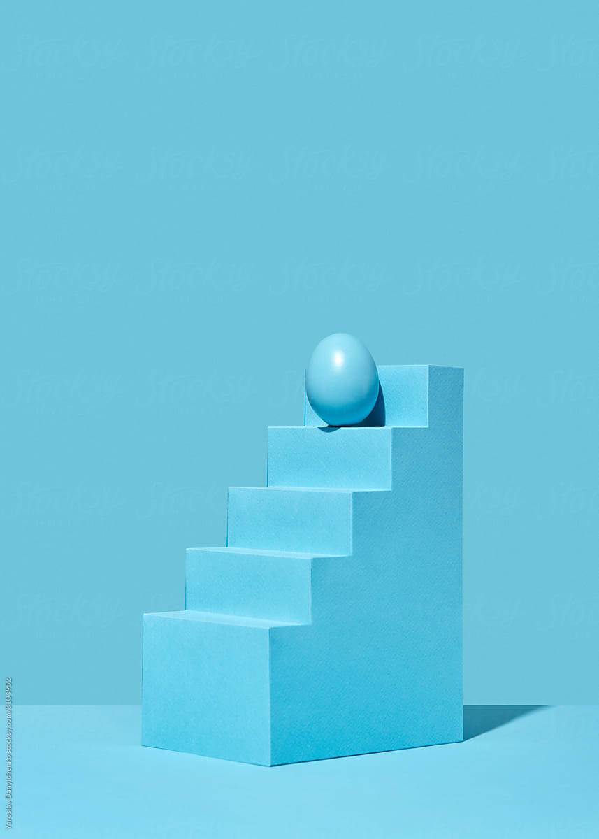 Easter egg on the top of plastic staircase.