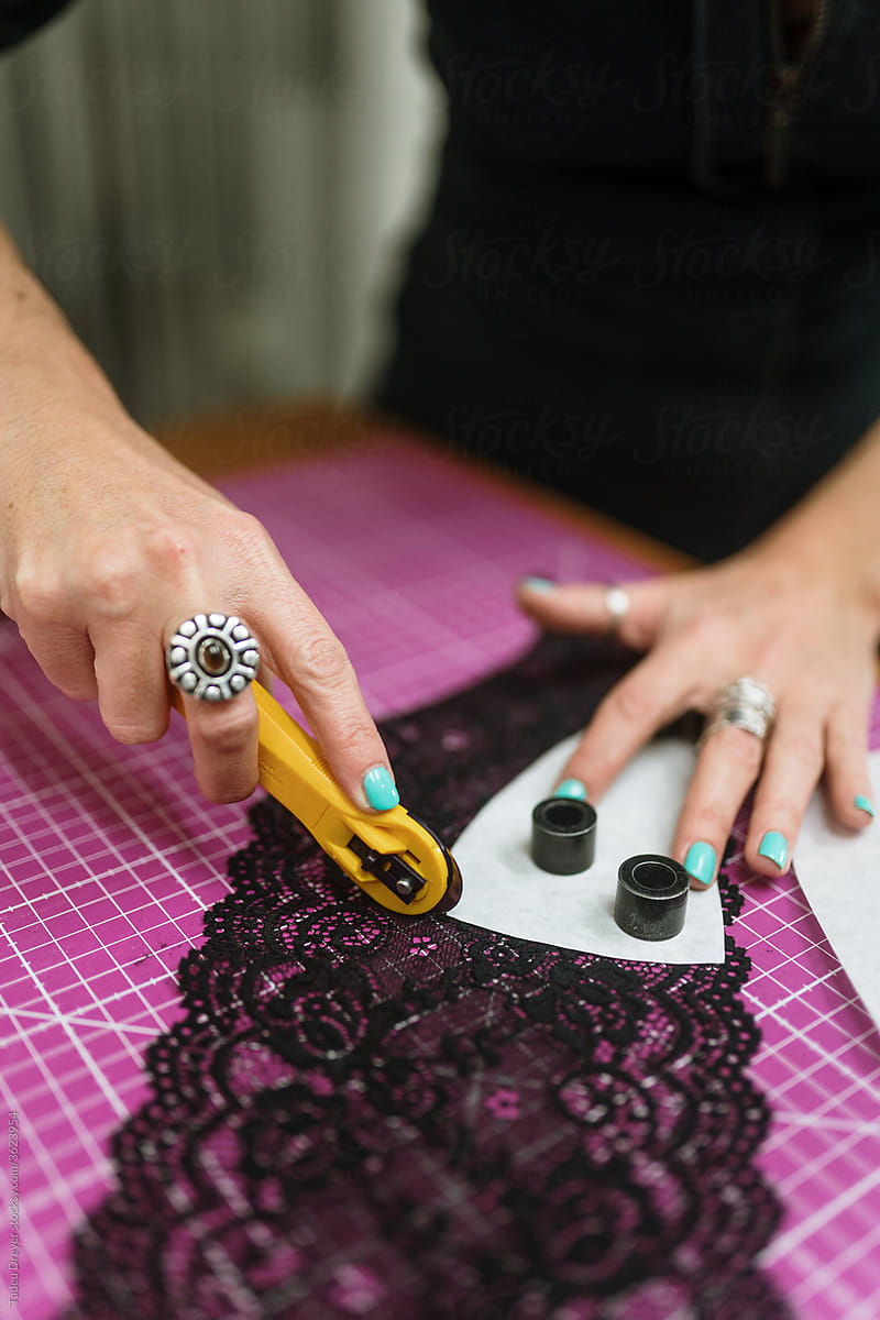 Woman cutting fabric to make a pattern