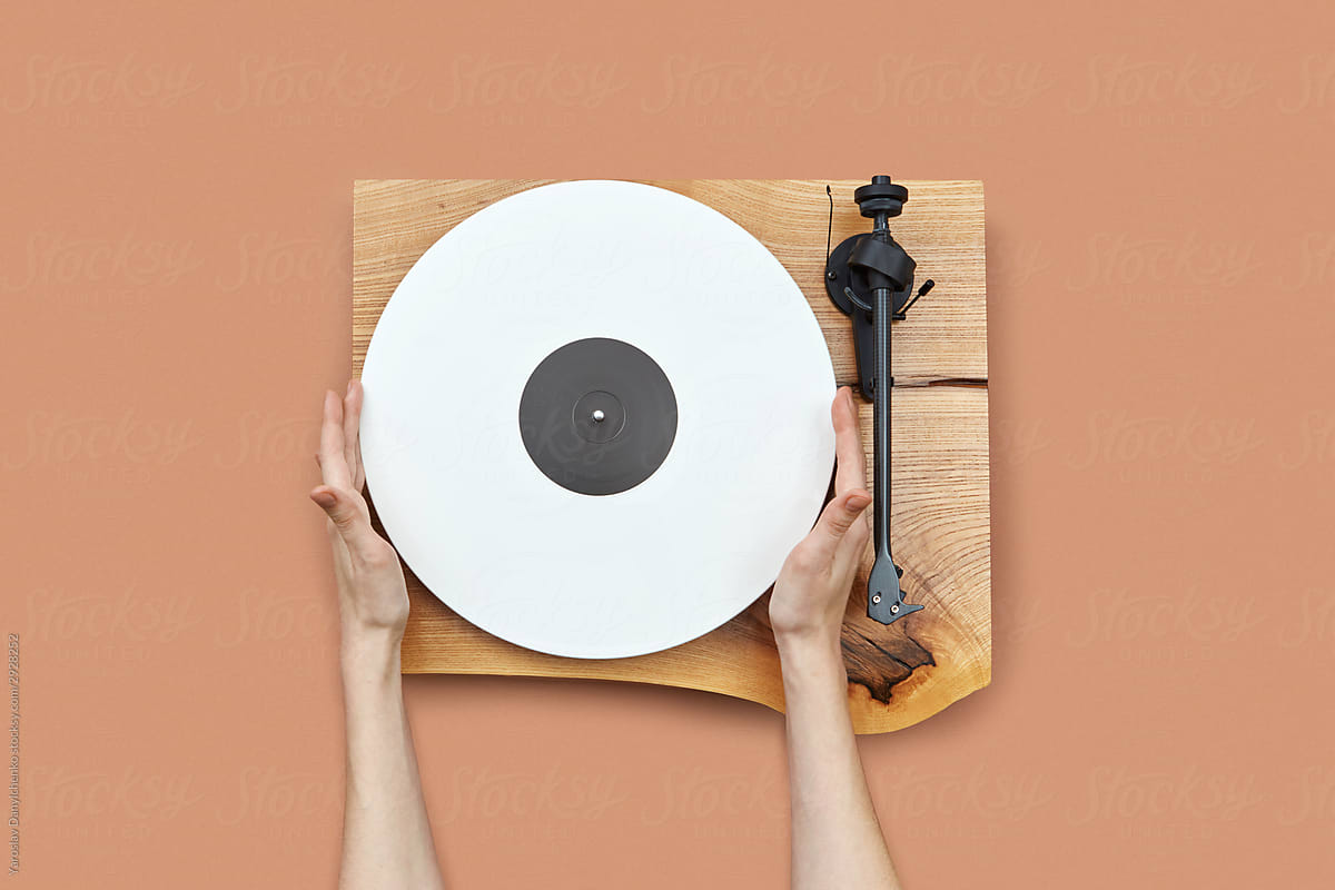 Woman\'s hands with vinyl record.