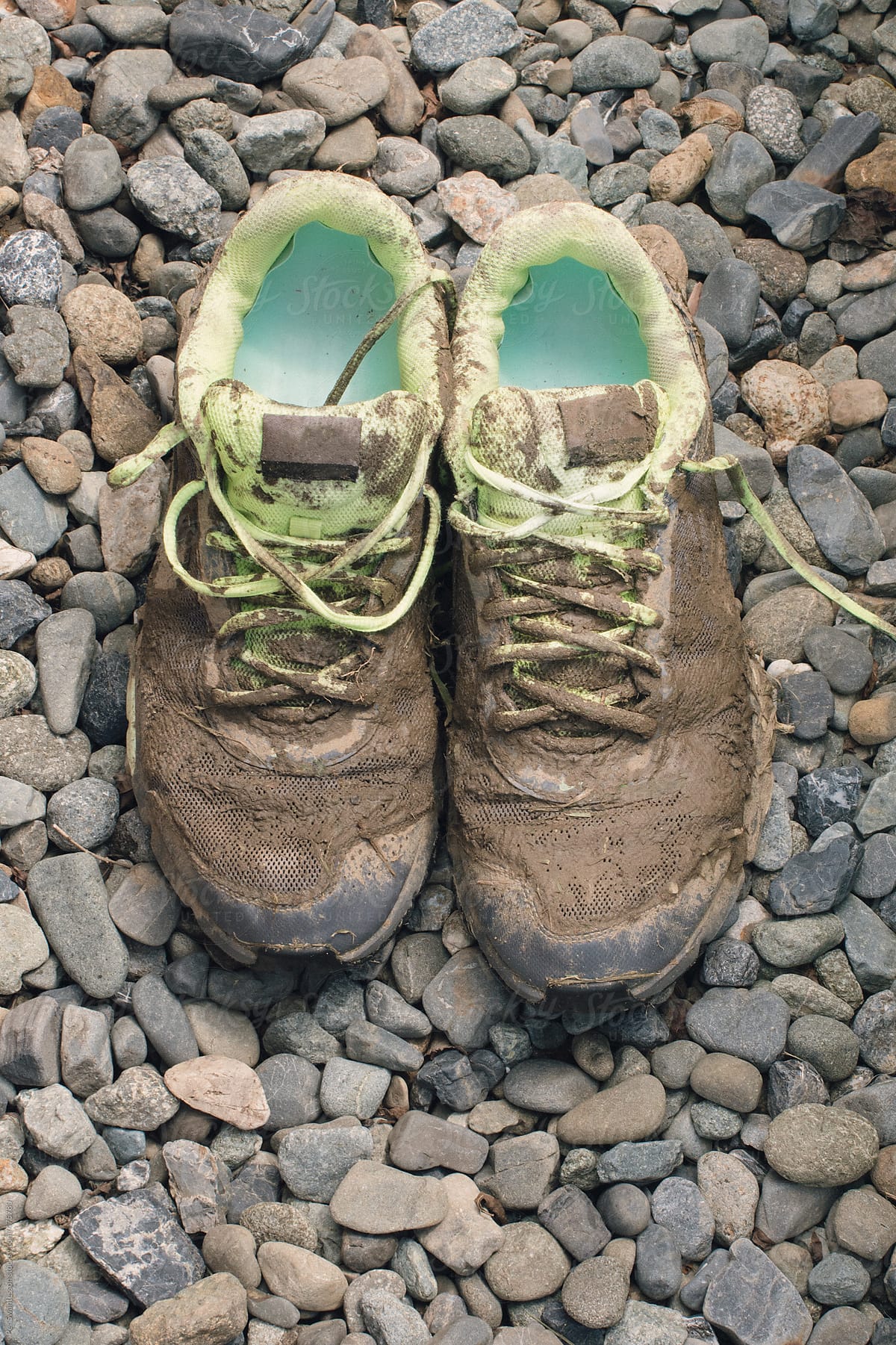 Pair of very dirty runners shoes after exercise