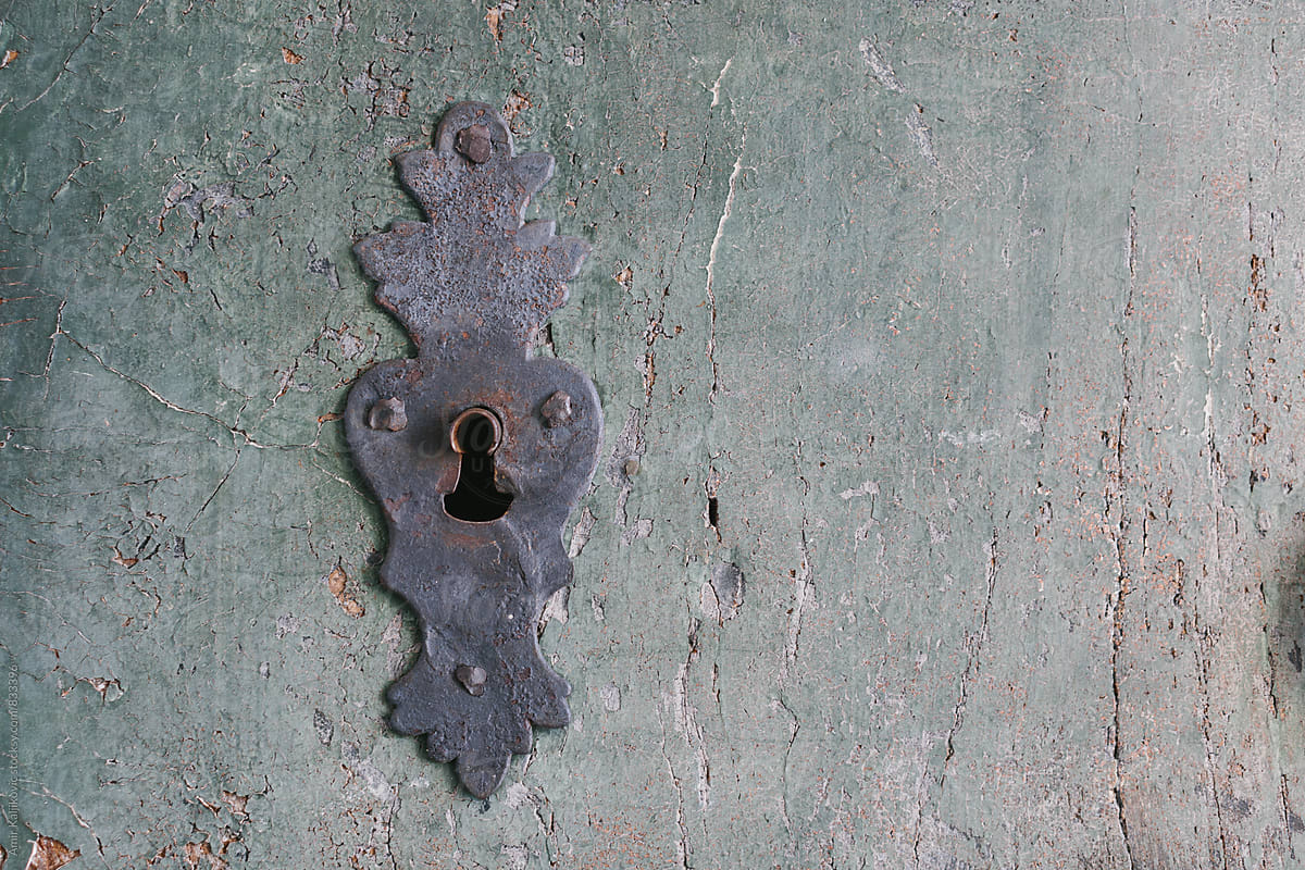 Old door lock with ornate escutcheon