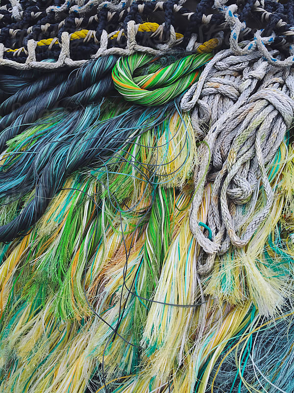 Close up of pile of colorful ropes and commercial fishing nets