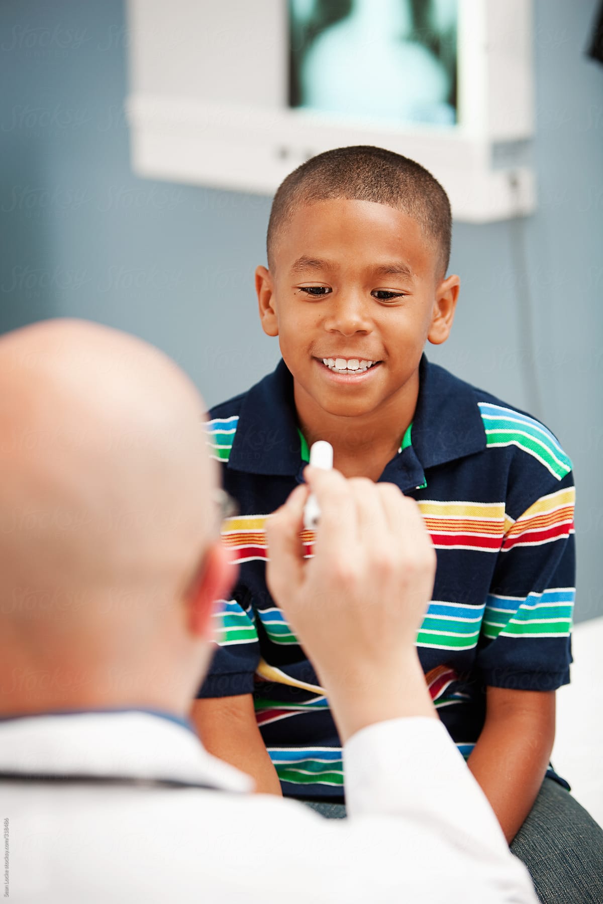 Pediatrician: Youth Undergoes Eye Testing from Pediatrician