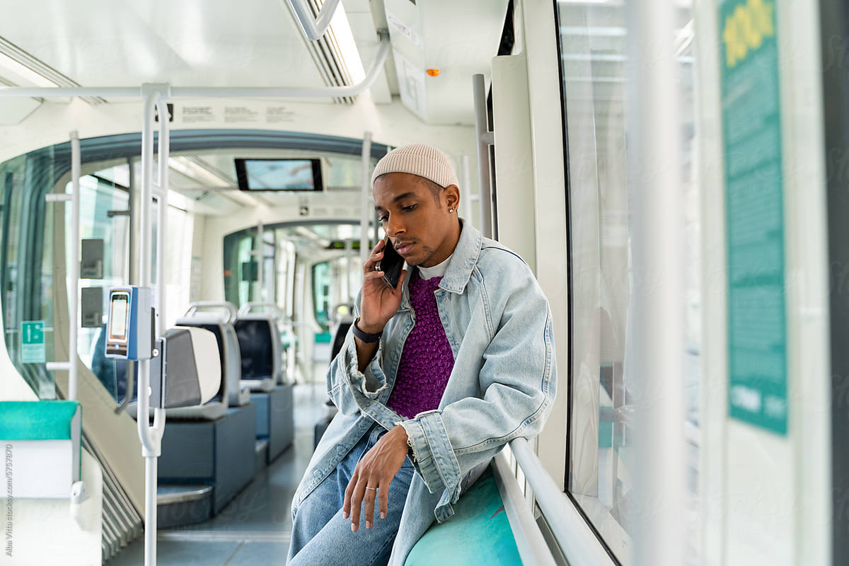 Man With Phone At Public Transport