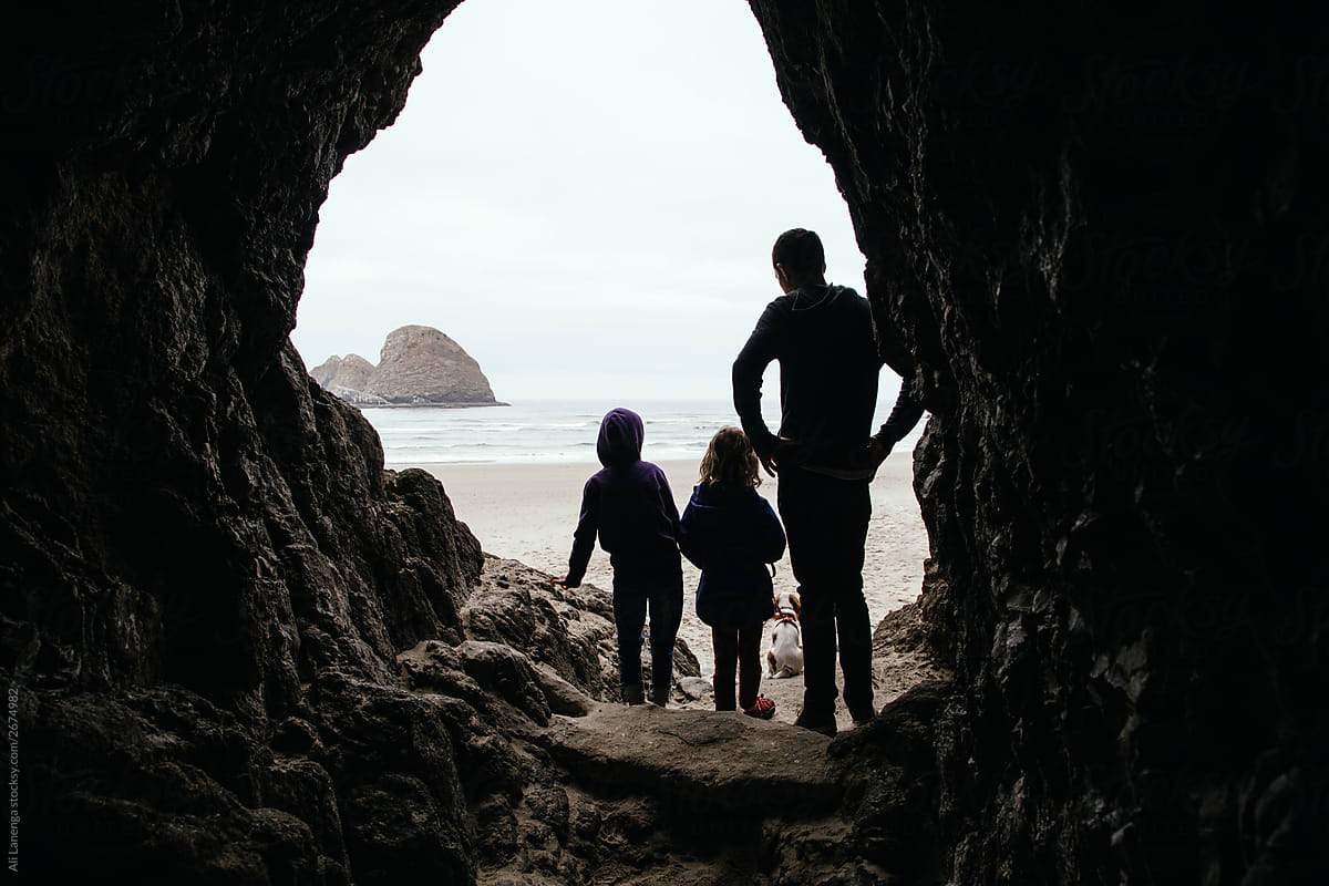 Family In Cave At Ocean