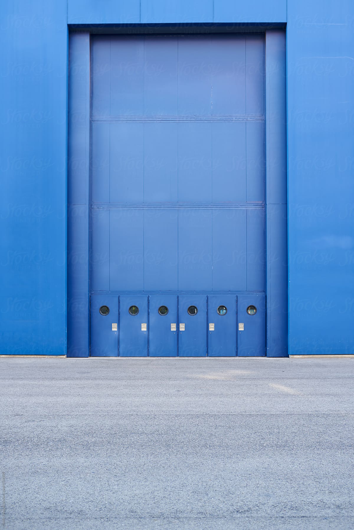 Rectangular garage entrance in blue wall.