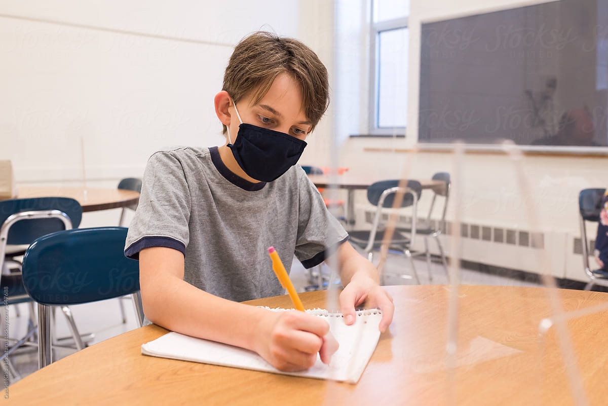 Boy with mask in classroom