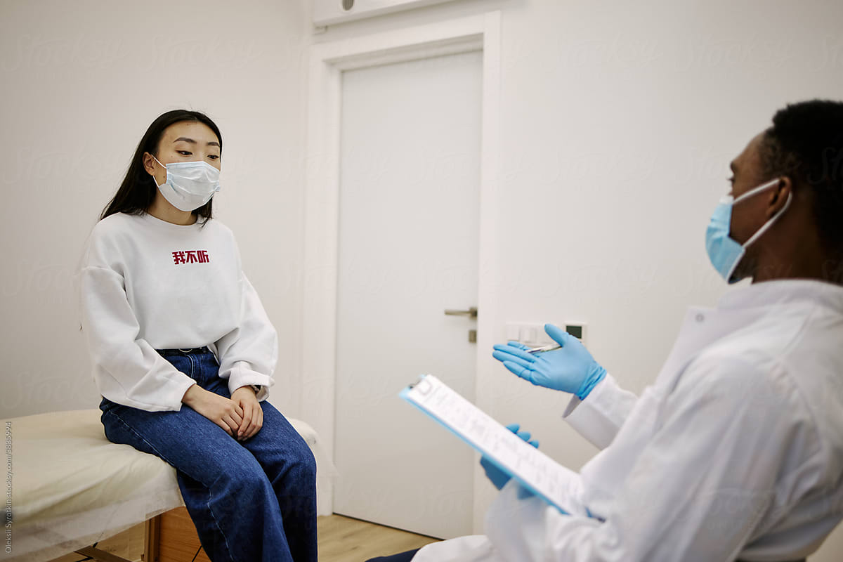 Asian woman having appointment with doctor