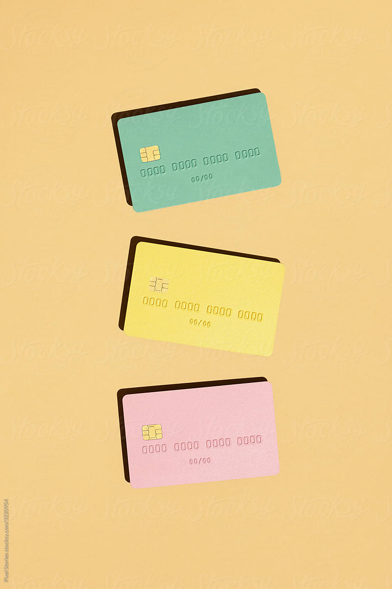 Pastel credit cards on peach background