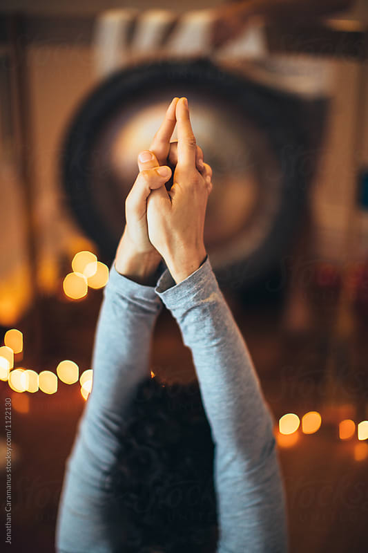 hands in prayer position during a yoga posture