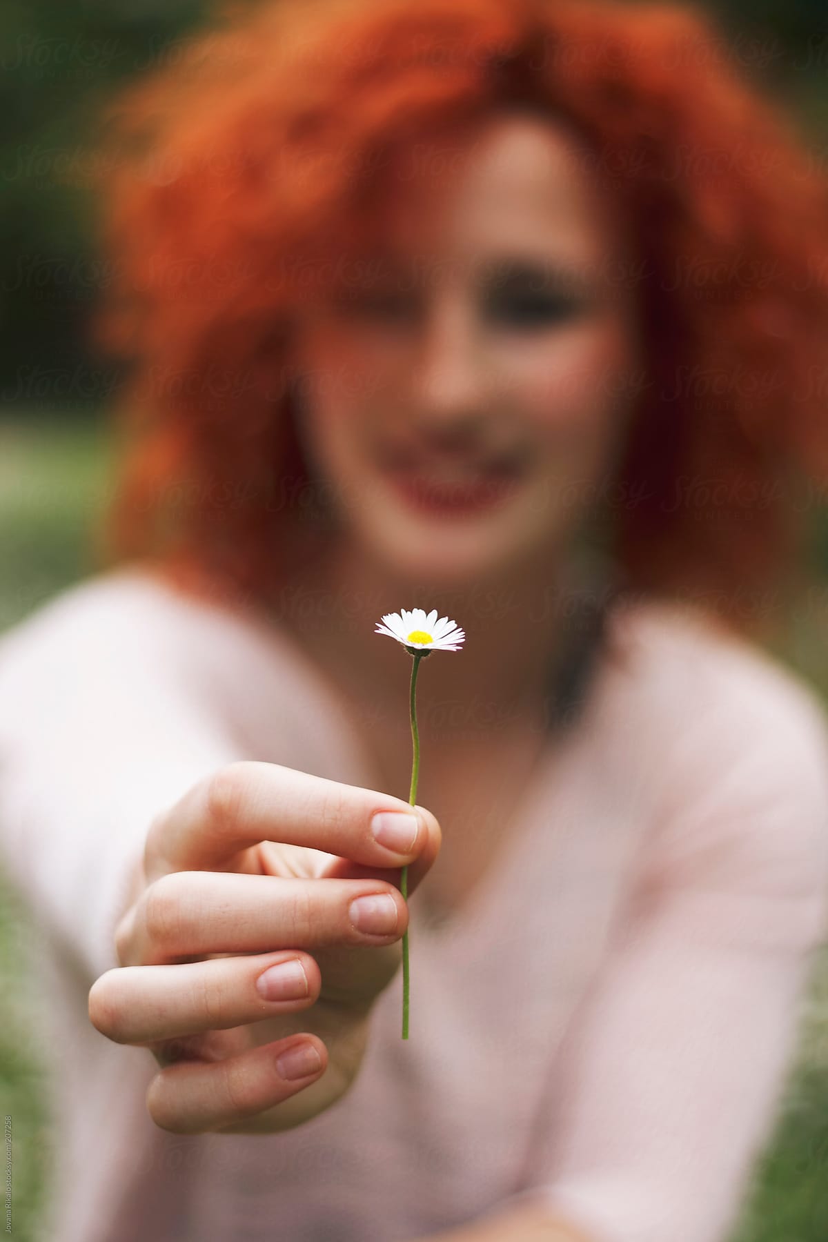 Beautiful Ginger Haired Woman Holding A Wild Flower By Stocksy Contributor Jovana Rikalo