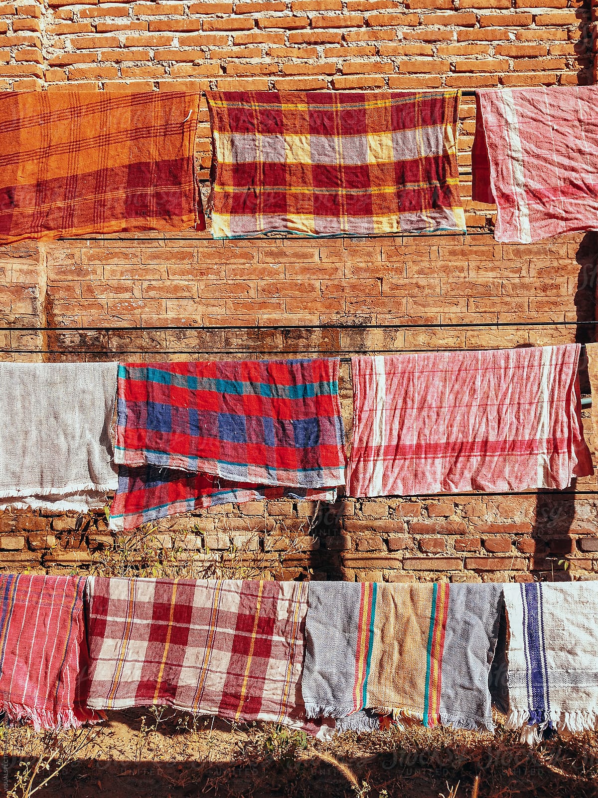 Colorful Cotton Towels Drying in Sun on Clothes Line