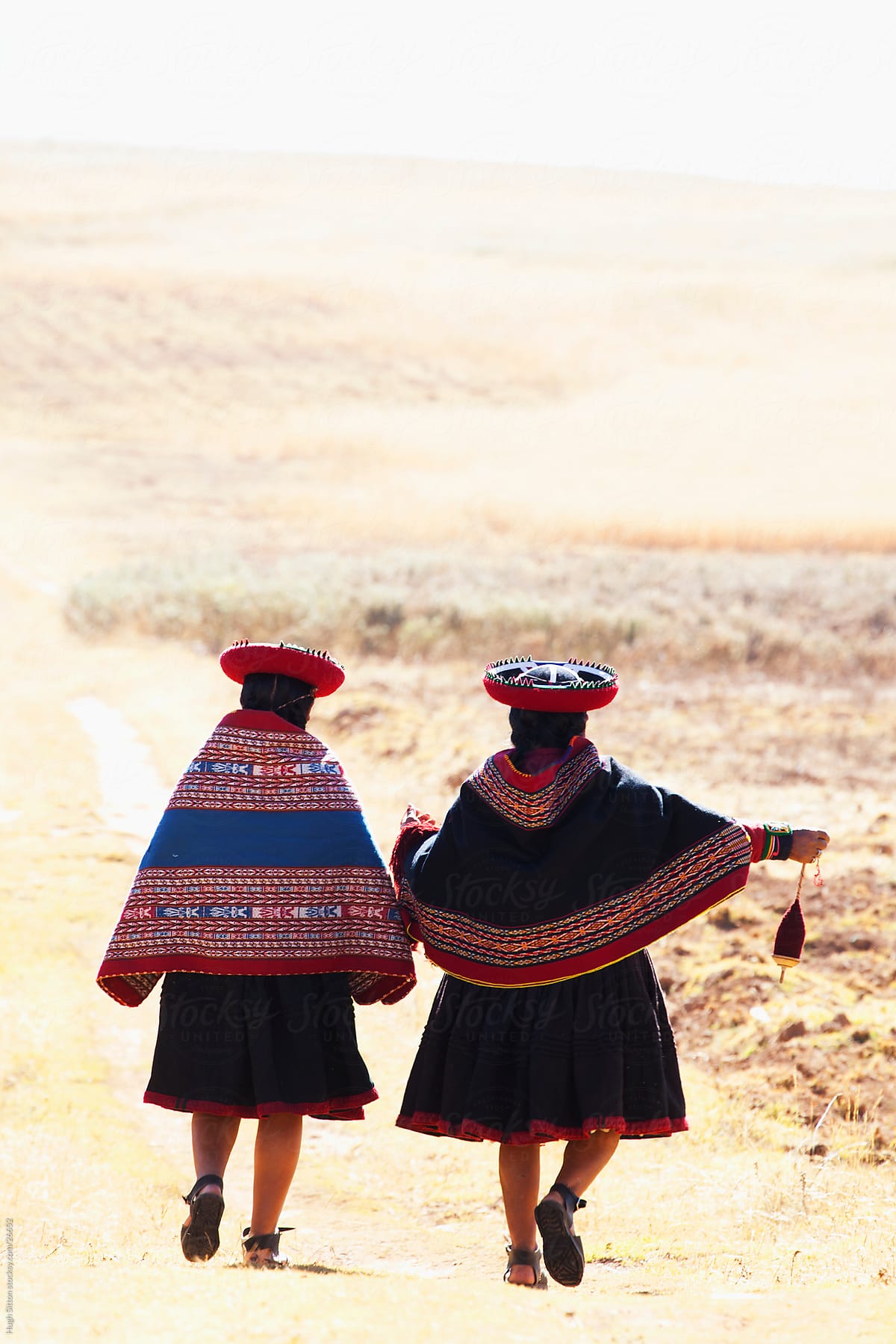 Two Quechua Indian women weaving. Cusco area. Peru