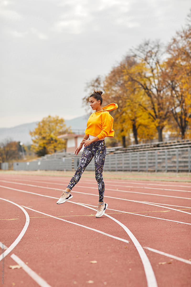 Woman training at a running track