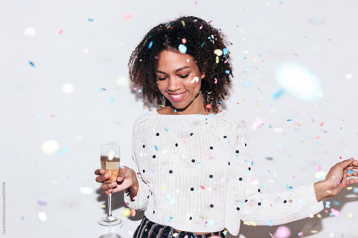 Mixed race woman celebrating a party