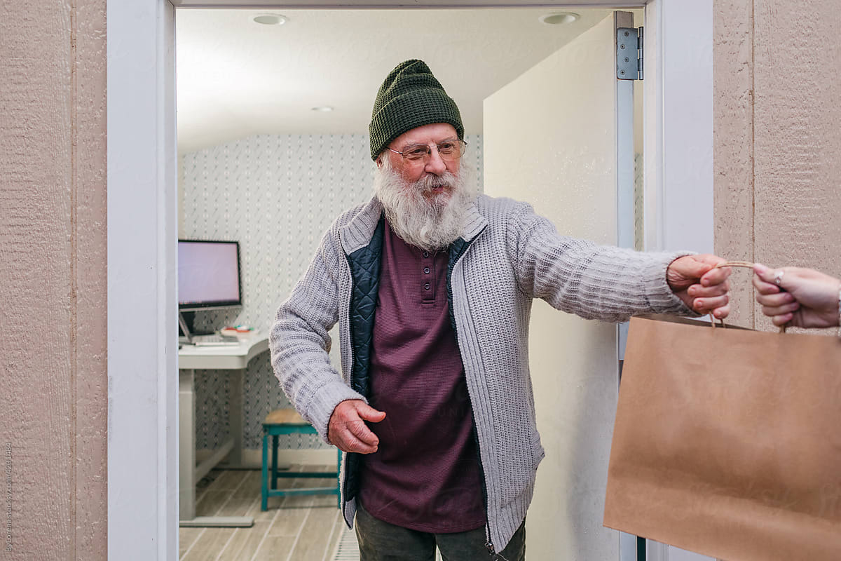 Elderly man picking up a home delivery