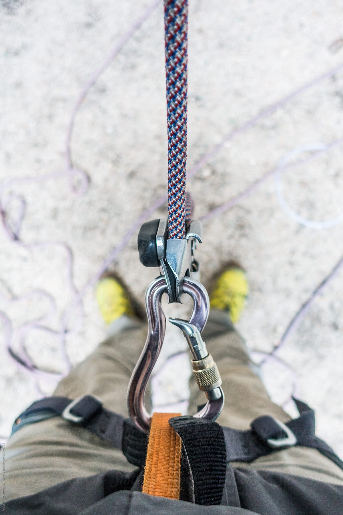 POV view of a man belaying in rock climbing