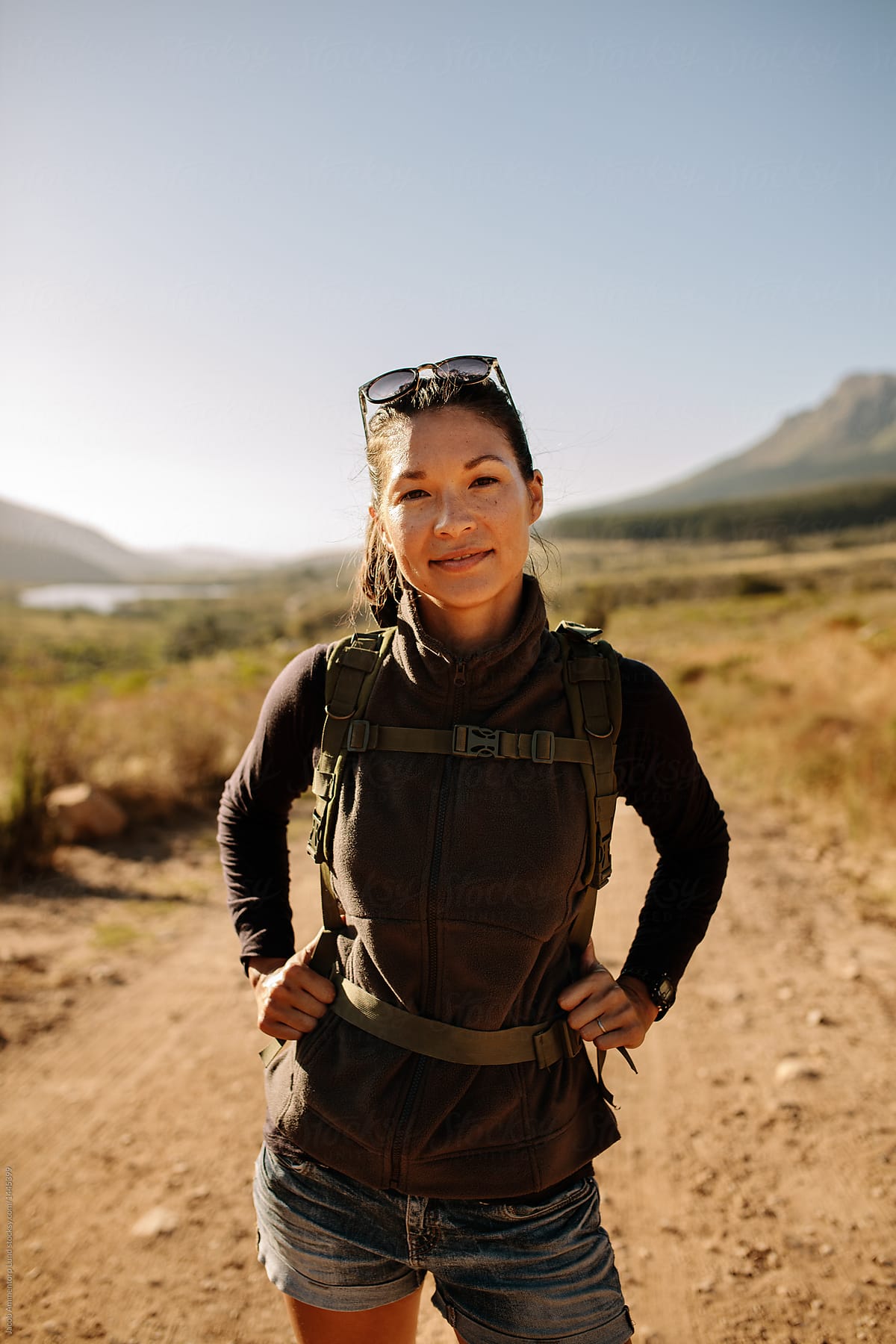 Woman hiking up the hill stock photo (169450) - YouWorkForThem