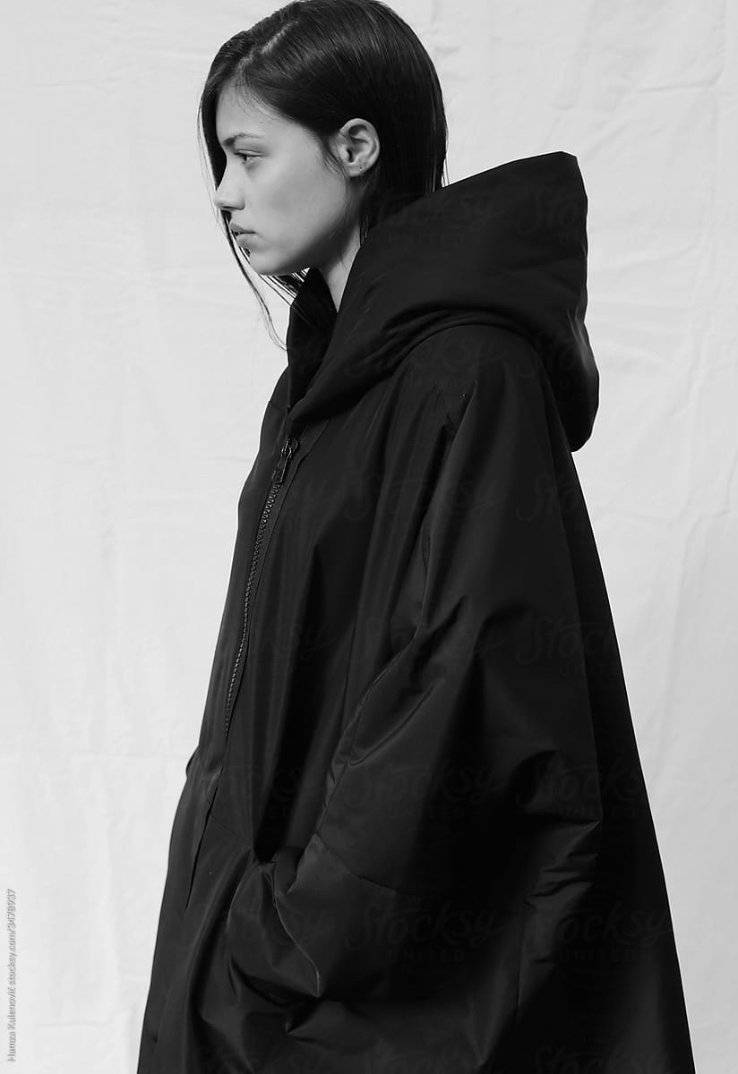 Simple portrait of a woman wearing minimalistic black jacket
