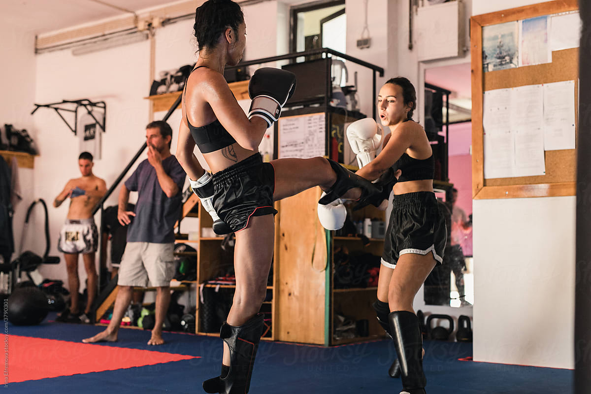 Thai Female Muay Thai Athlete Kicking The Opponent