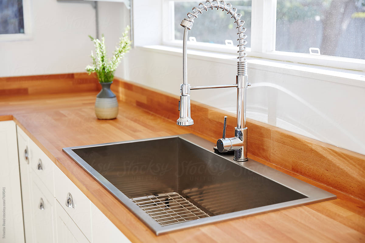 Kitchen sink and faucet with butcher block countertops