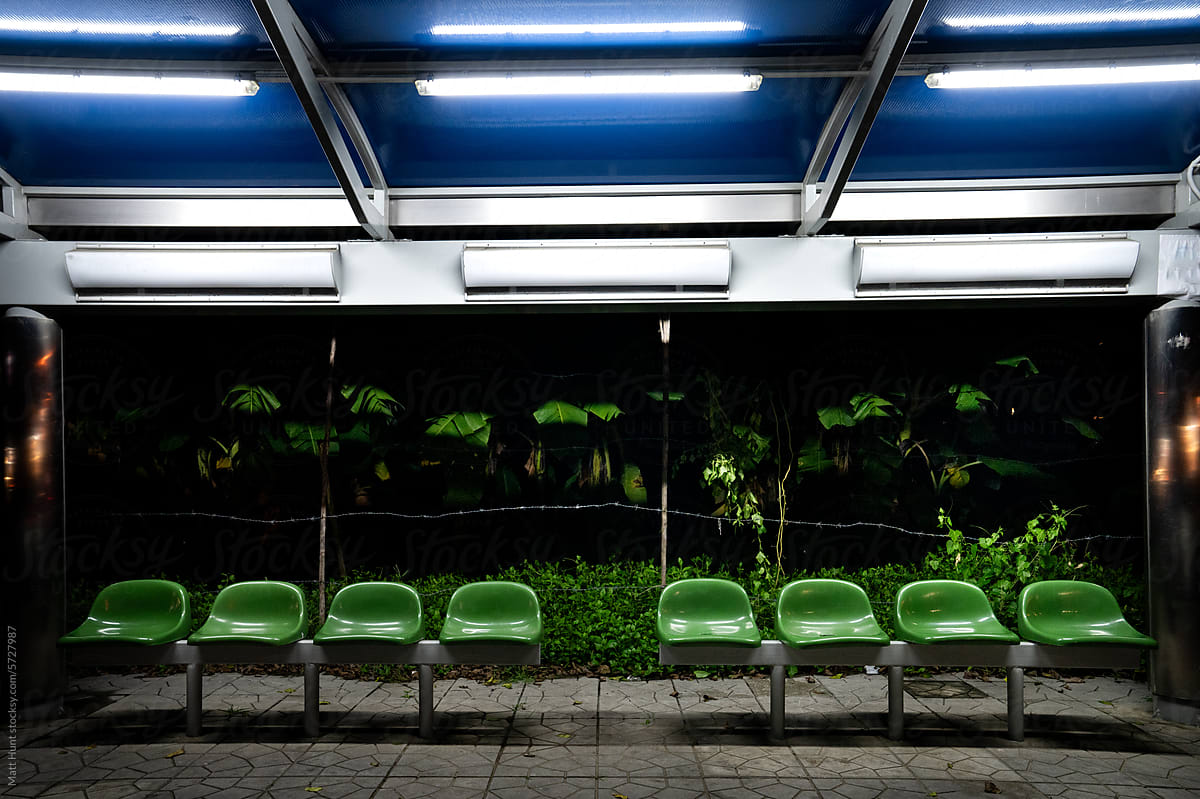 A late-night bus stop in the jungle alongside a highway in Thailand