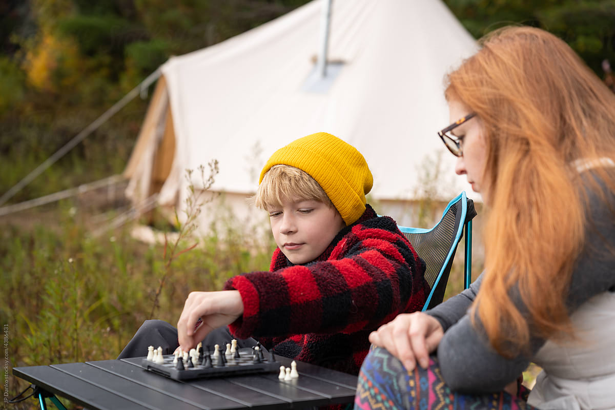 Family Playing Chess Wilderness Camping