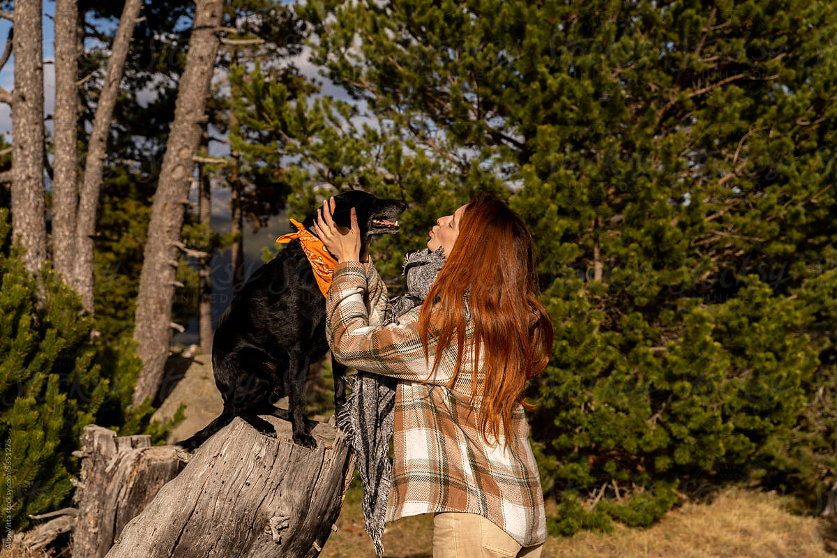 woman and dog in nature