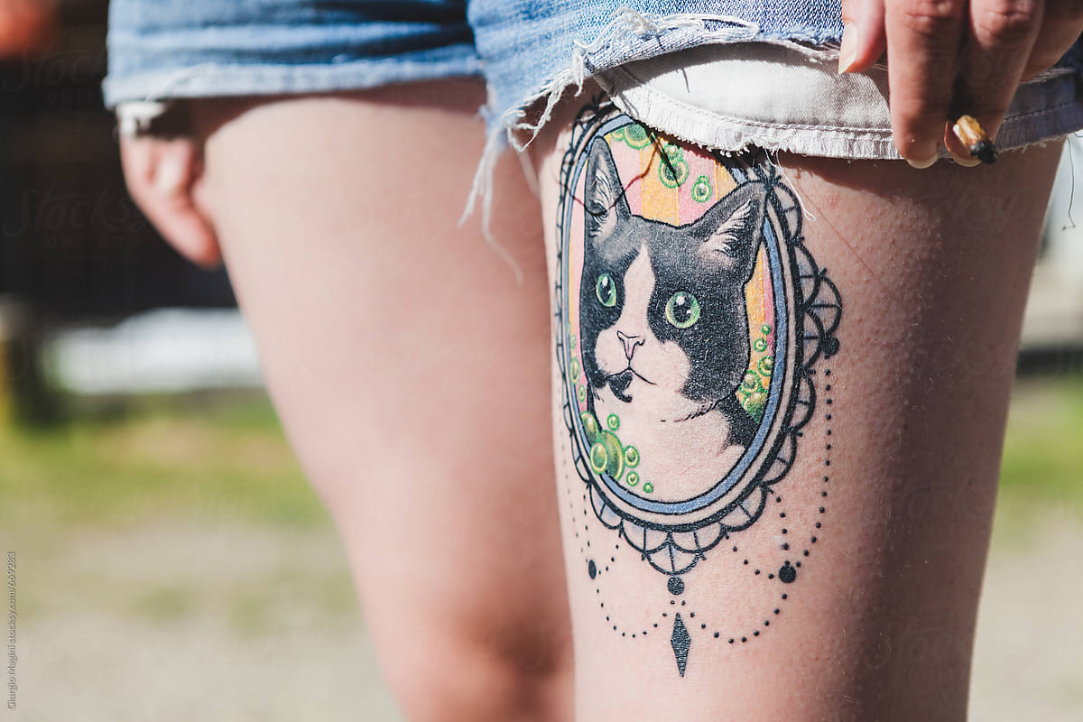 Cat Portrait Tattooed on a Woman\'s Thigh