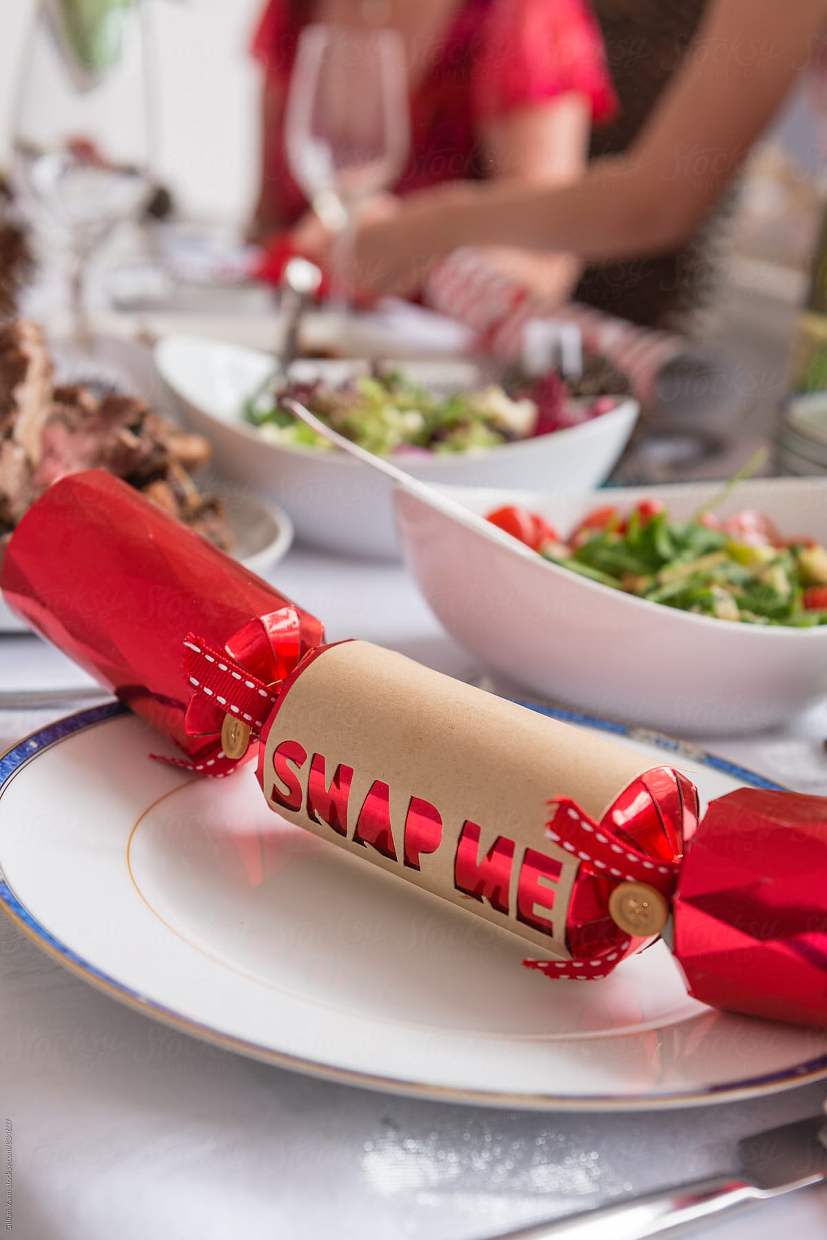 christmas cracker on a plate at christmas lunch