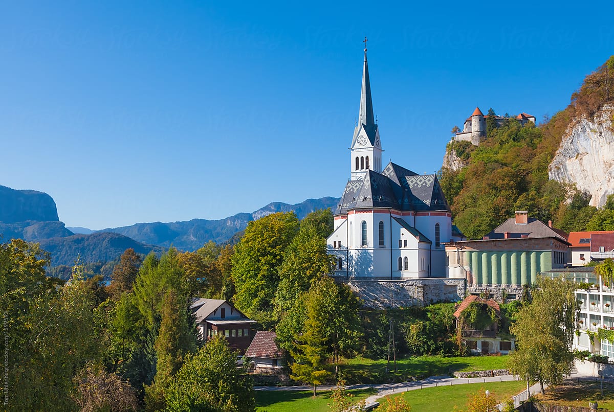 Bled, Slovenia - View of the Town\'s Church, with the Alps and the Castle in the Background