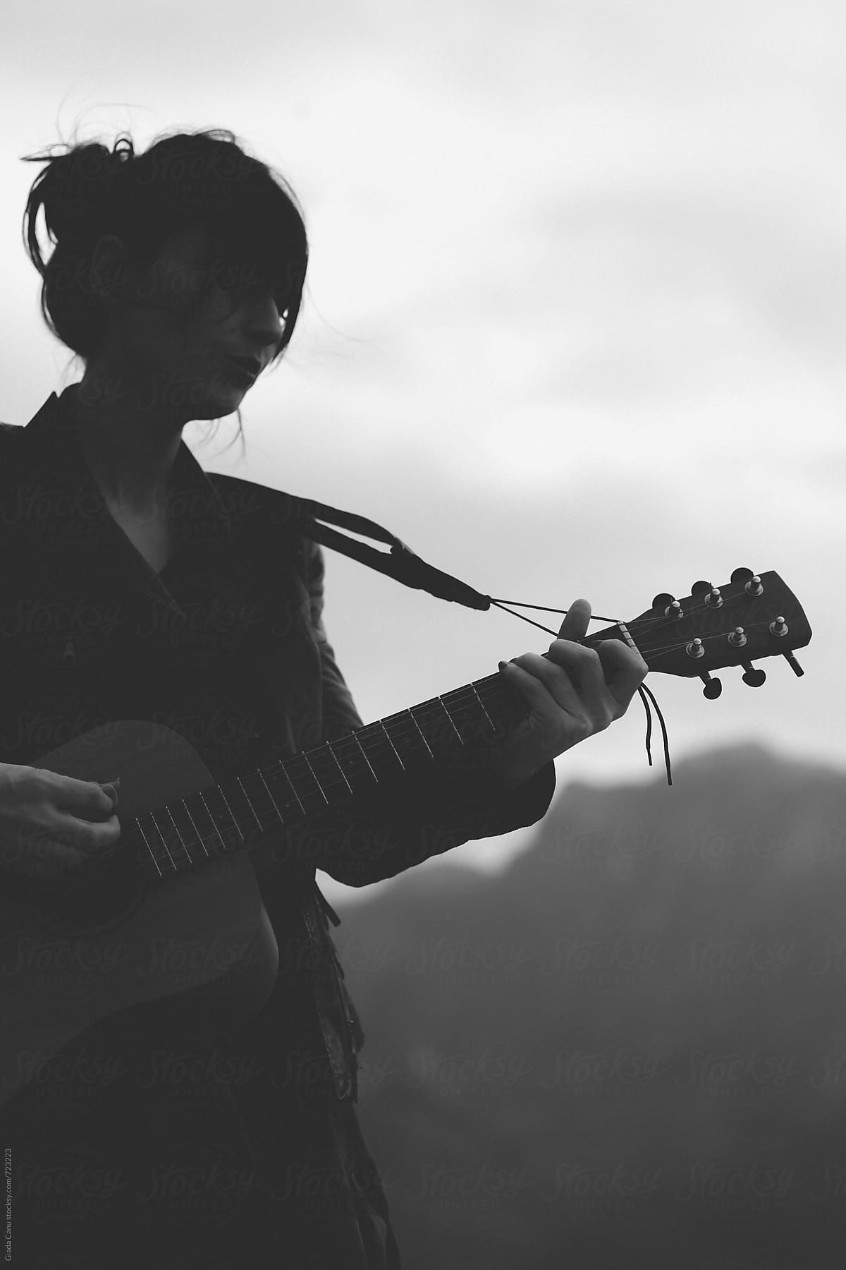 Woman Playing Guitar In Nature By Stocksy Contributor Giada Canu