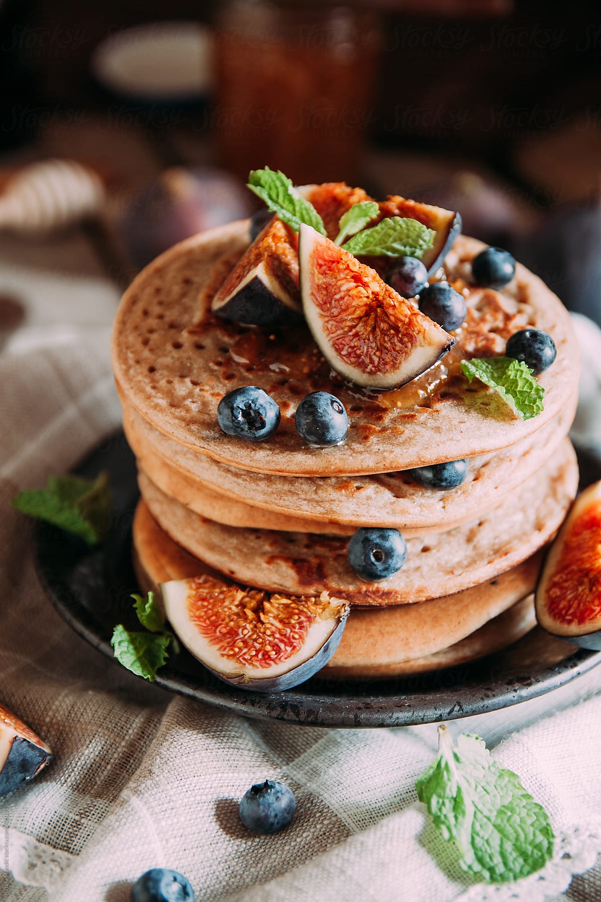 Delicious breakfast. Homemade pancakes with fresh figs and bluberries