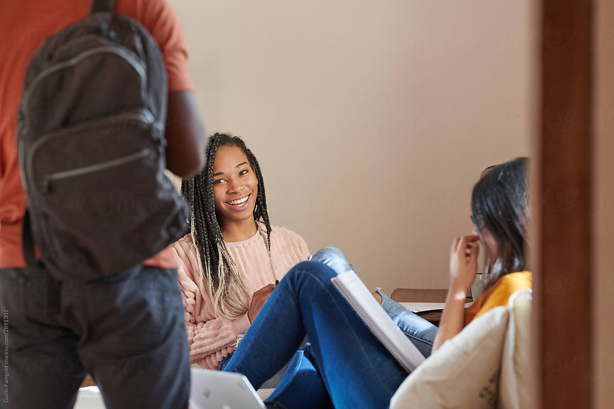 Multiracial group of students meeting at home