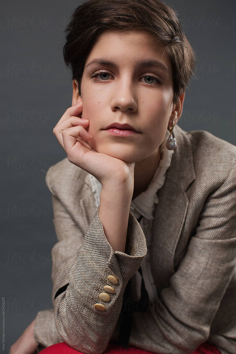 Young model with short hair in elegant clothes