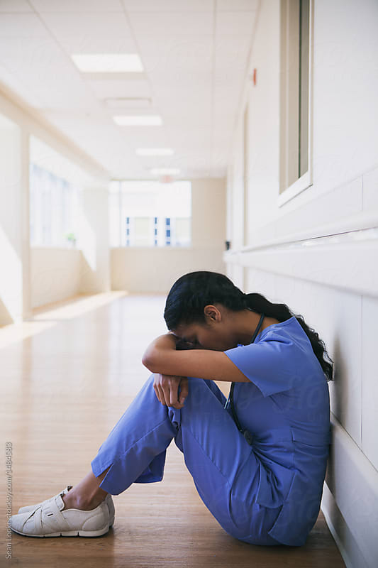 Hospital Frustrated Nurse Sits In Hallway Alone By Sean Locke