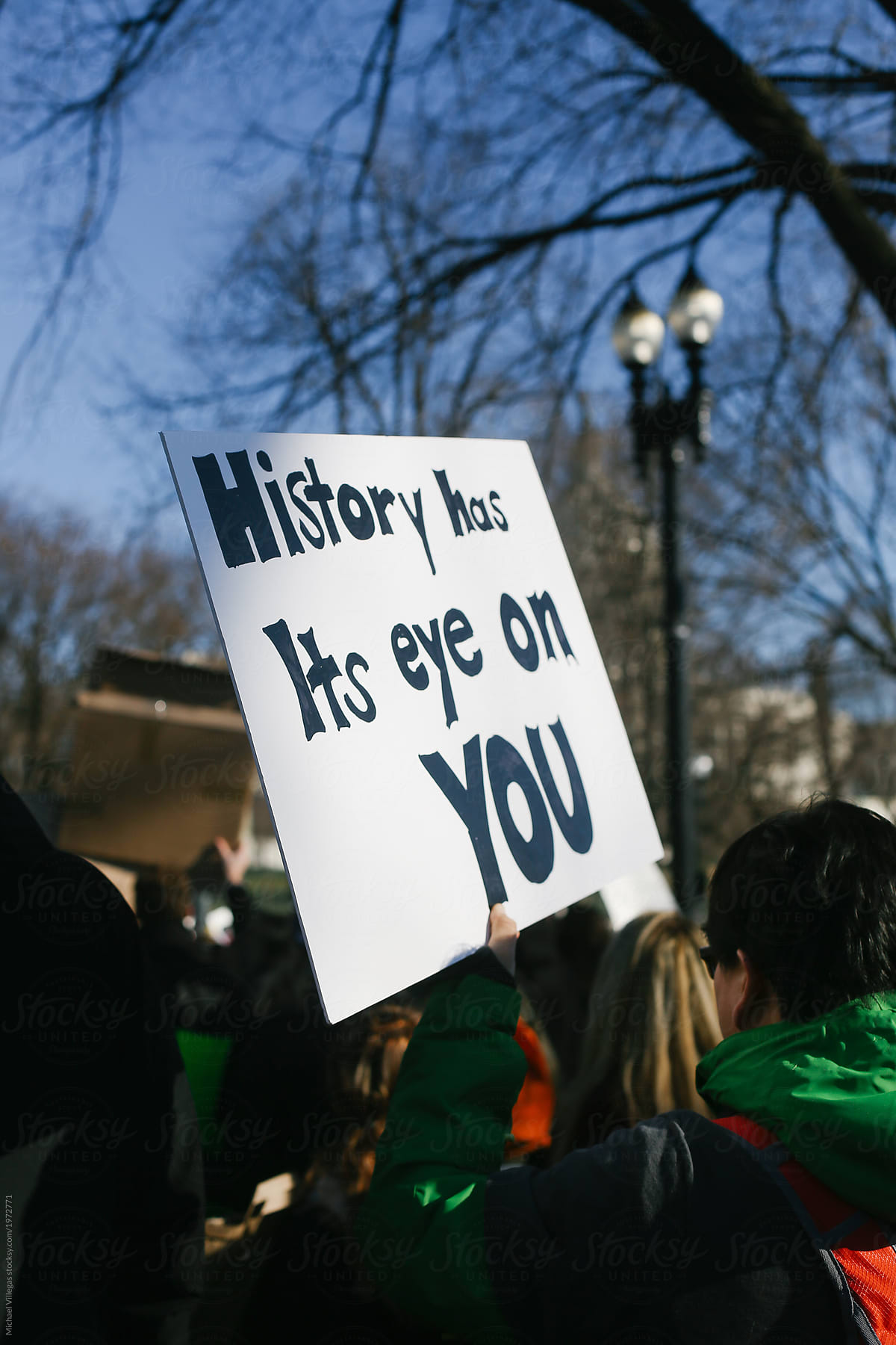 Protest: Person Holds Sign That History Has Its Eye On You