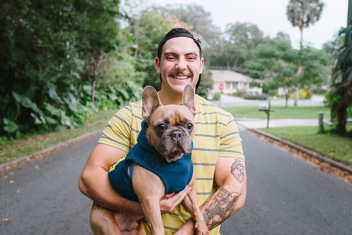 Smiling man with Frenchie