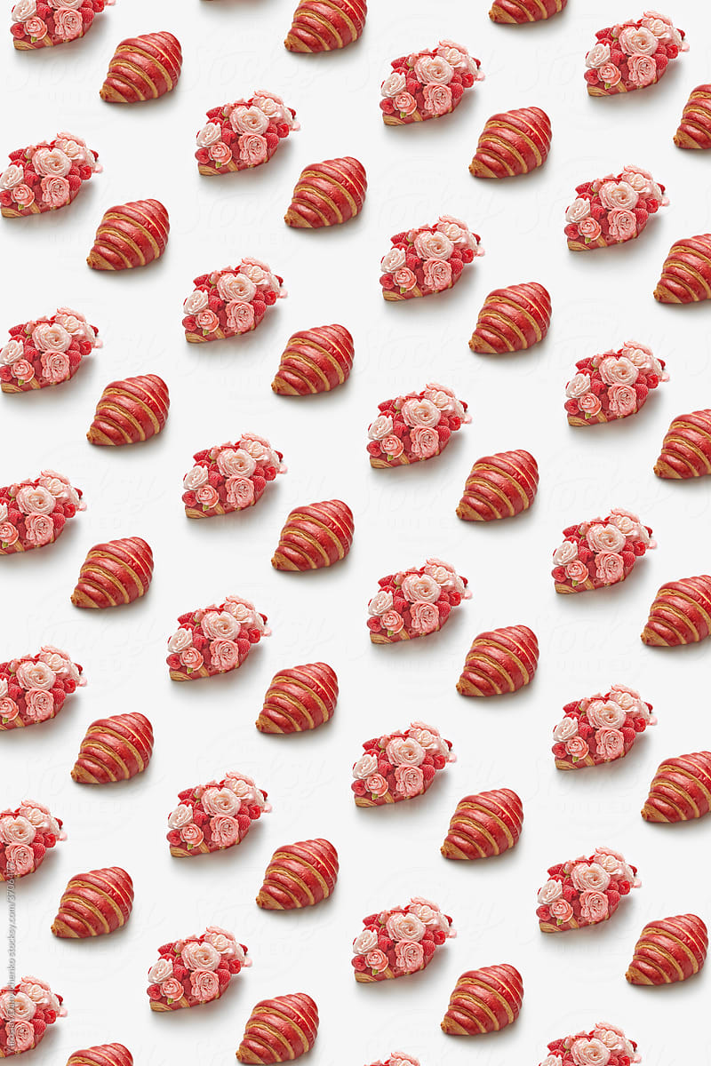 Pattern of croissants, raspberries and roses on white background
