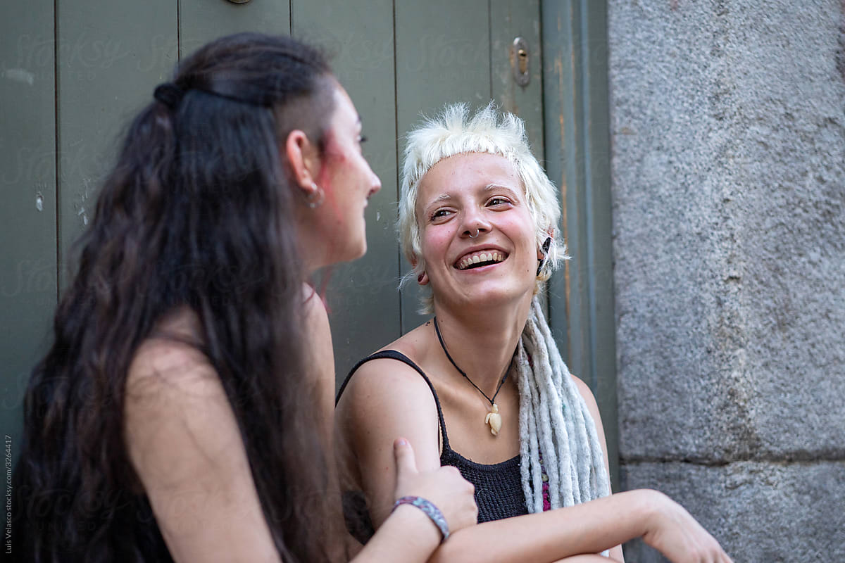 Punk Lesbian Girls Talking And Smiling Outdoors By Luis Velasco