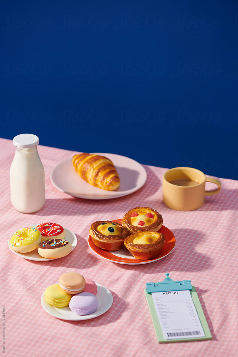 Snack at tea time with cheese bread, tart eggs, donuts using tea set