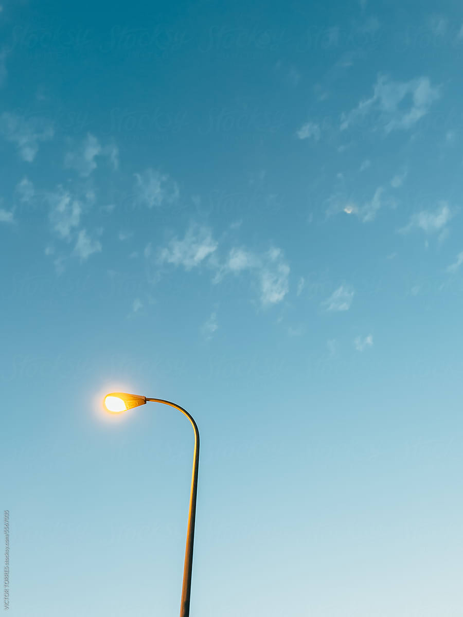 Lonely streetlamp over a blue sky