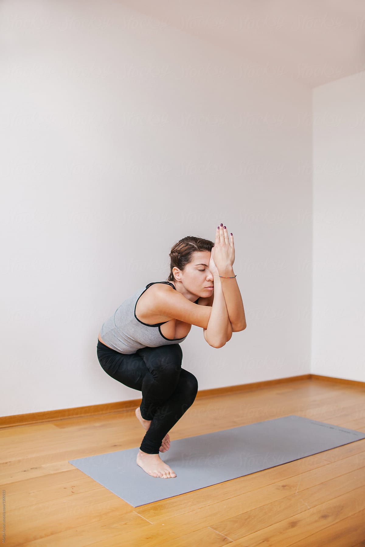 Young Woman Doing Yoga by Stocksy Contributor Marija Kovac - Stocksy