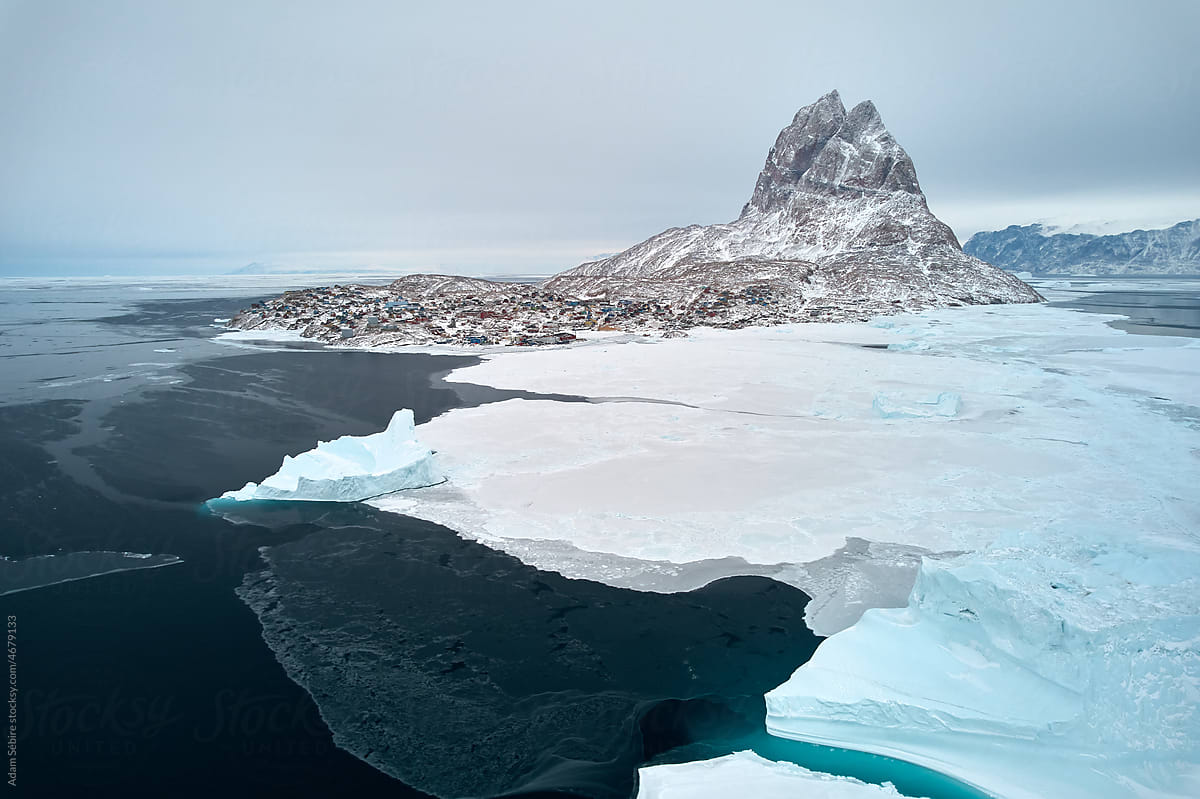 Icebergs frozen into sea ice, Uummannaq Island Greenland, mid winter