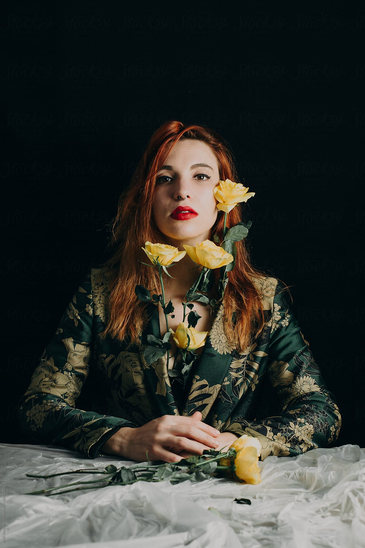 Portrait Of A Cool Ginger Woman With Yellow Roses Wearing A Floral Suit By Stocksy Contributor